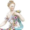 Meissen Figurine Of A Lady Holding A String Of Flowers