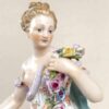 Meissen Figurine Of A Lady Holding A String Of Flowers