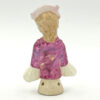 Porcelain Glazed 20th Century Half Doll Holding Yellow Flower